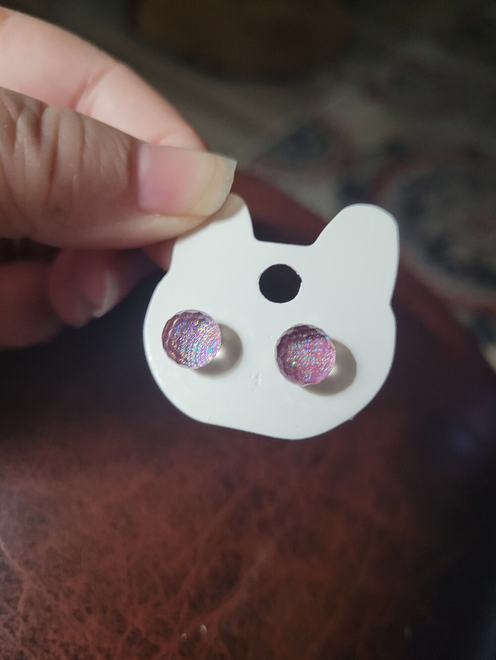Round, pink-and-purple iridescent glitter stud earrings